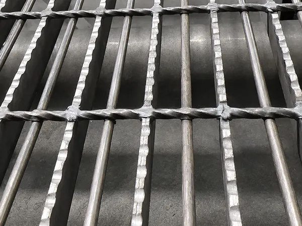 Close-up of offshore platform reinforced floor grating showing reinforced round bars and welded grating structure.