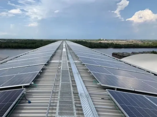 Rooftop solar panel walkways along a metal roof