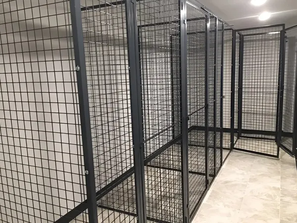 Black wire mesh tenant storage lockers.